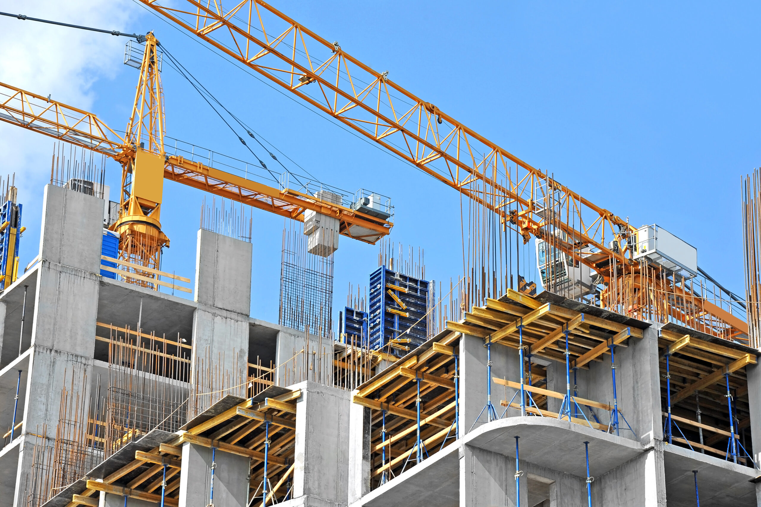 Looking up at construction site with crane