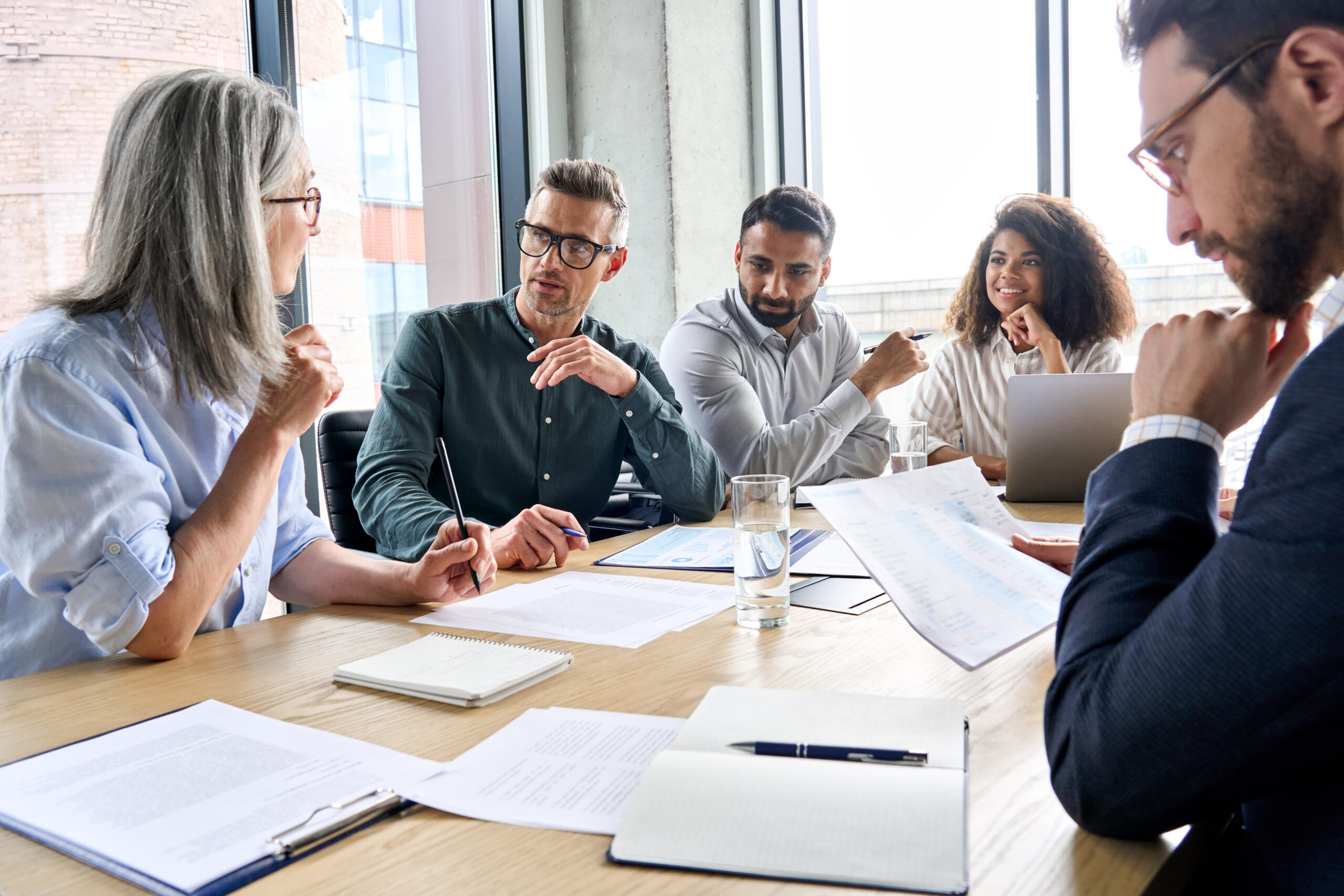 People in business setting meeting at a table