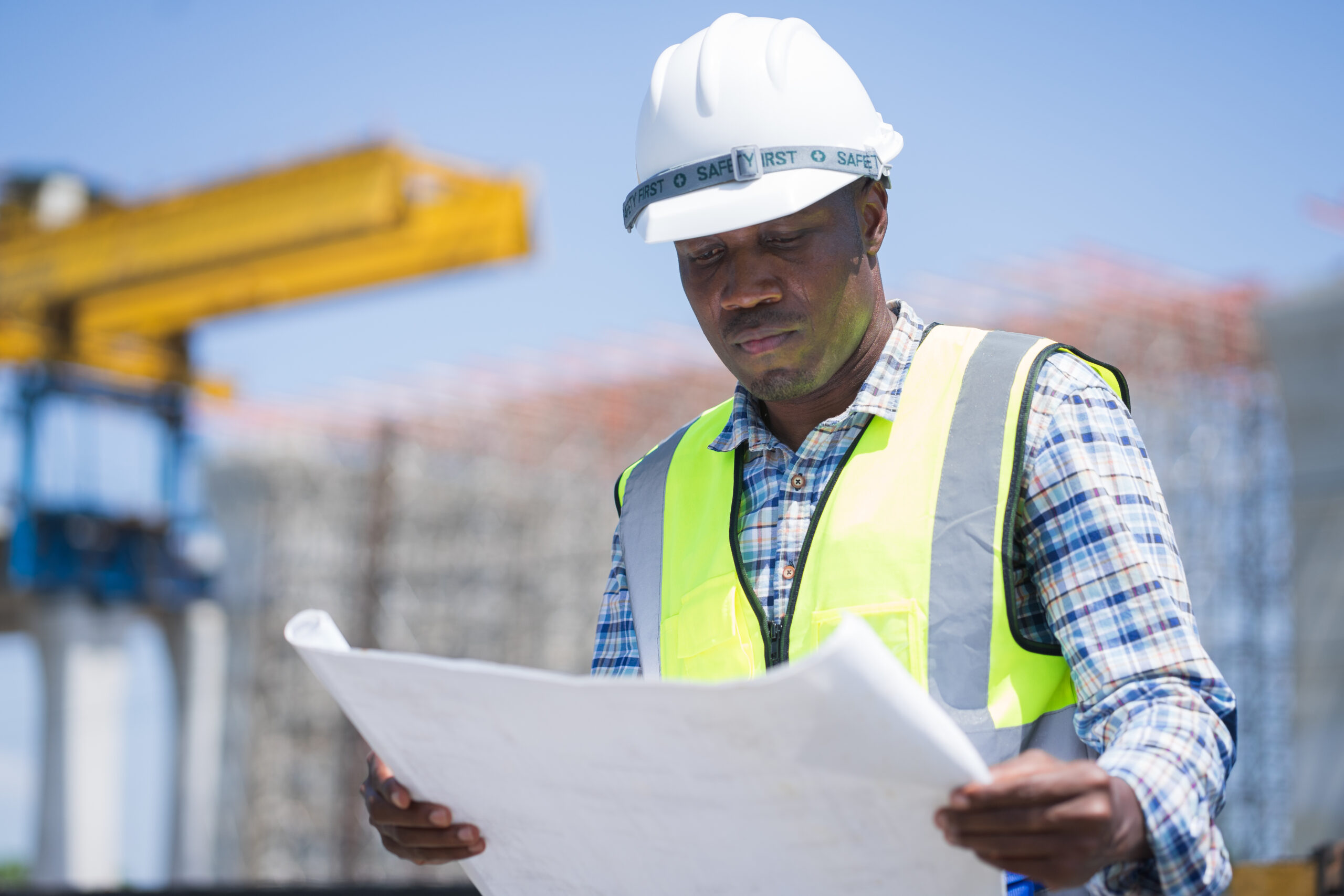 Engineer looking at construction plans